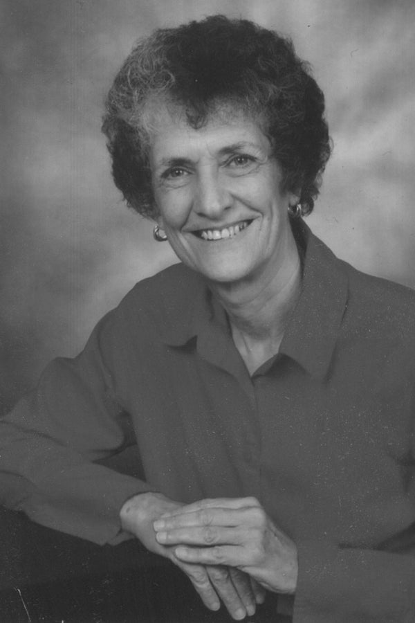 Black and white portrait of a woman with a neutral background