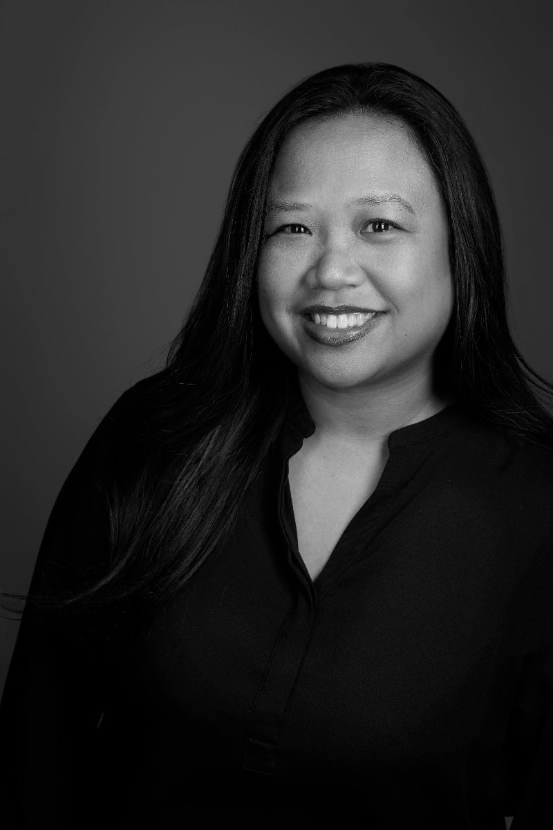 Black and white portrait of Analene Go with a neutral background