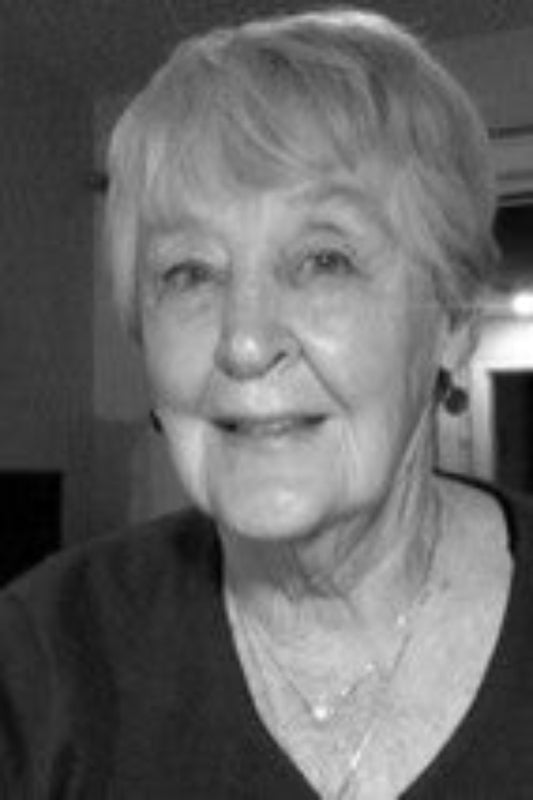Black and white photo of an elderly woman with short hair.