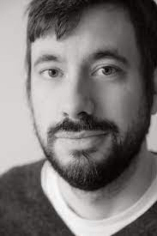 Black and white portrait of a person with a beard