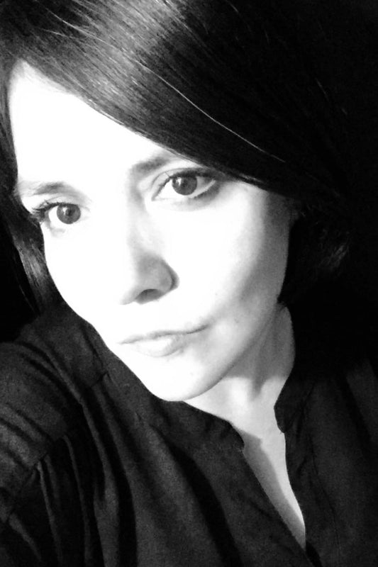 Black and white portrait of a woman with dark hair.