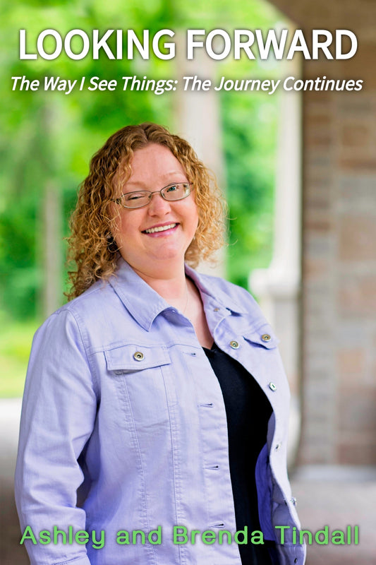 Woman with glasses and a light blue jacket standing outdoors with text overlay
