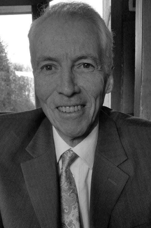 Black and white photo of a man in a suit and tie