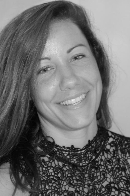Black and white photo of a woman with a lace top