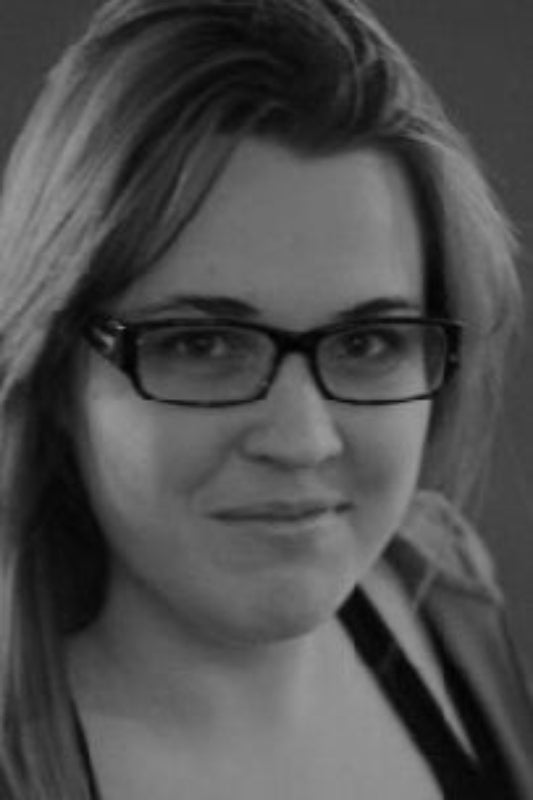 Black and white portrait of a person with glasses
