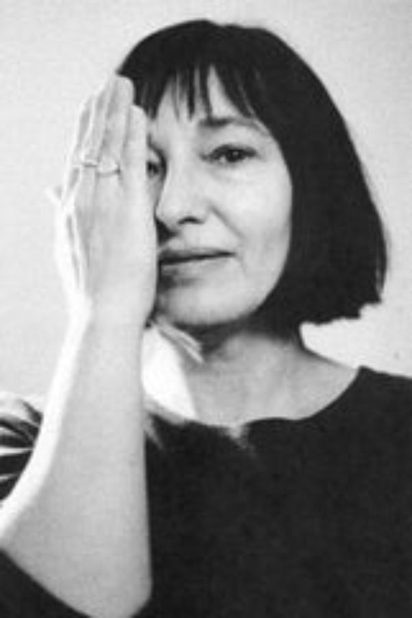 Black and white portrait of a person with one hand on their face