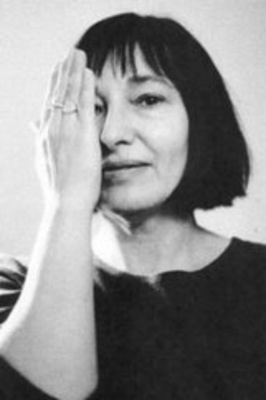 Black and white portrait of a person with one hand on their face